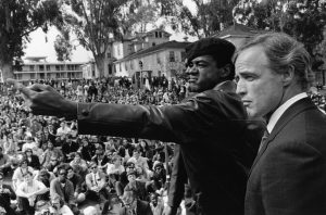 Bobby Seale Marlon Brando at Bobby Hutton Memorial Rally 0468 by Jeff Blankfort web